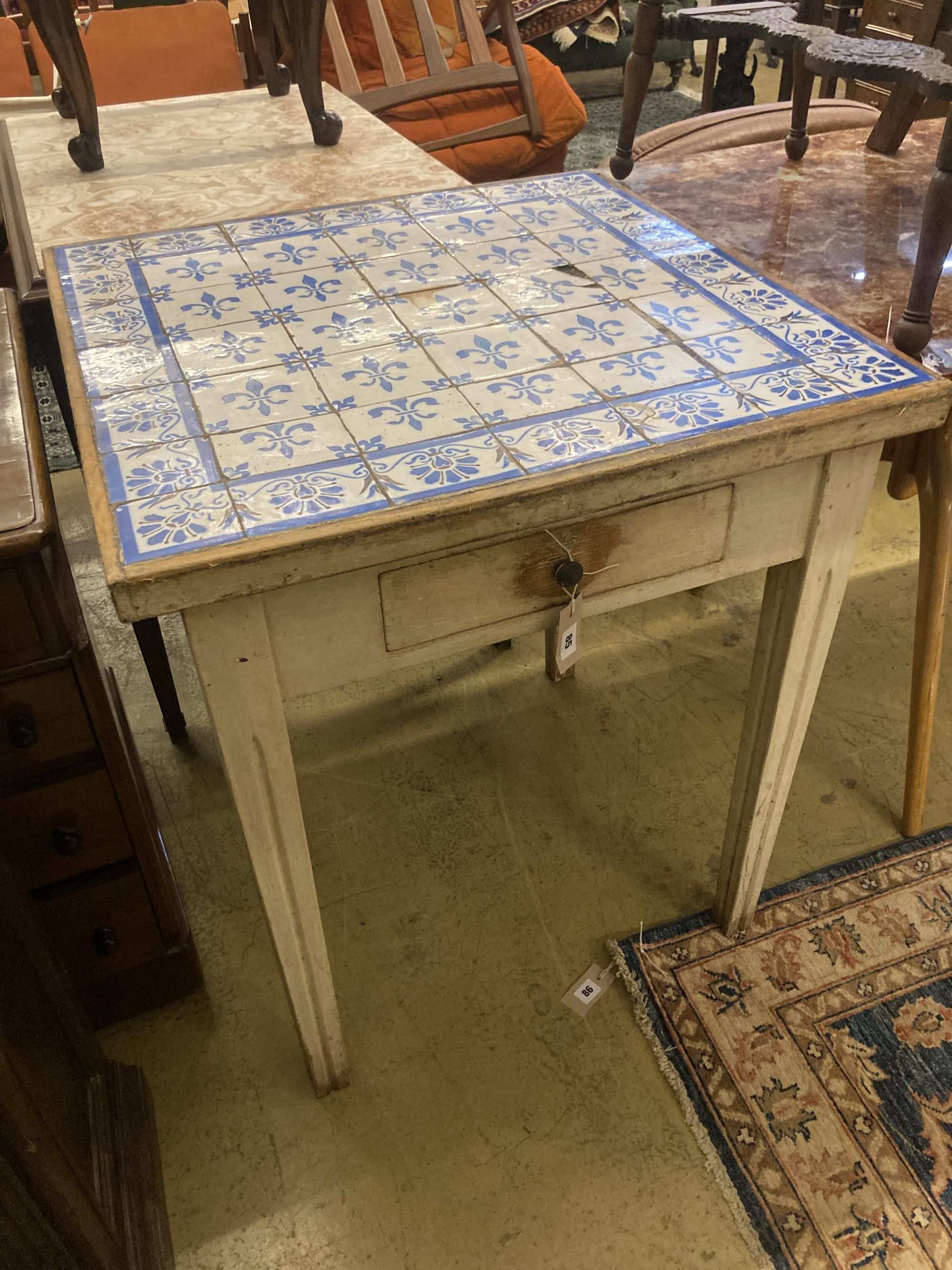 A Continental painted tile top table, width 71cm depth 70cm height 78cm
